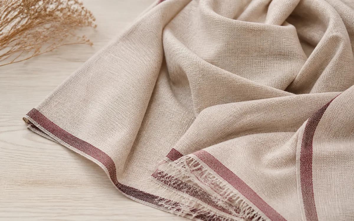Editorial still life of a handwoven scarf, representing dupattas & scarves sourcing in Surat, Gujarat