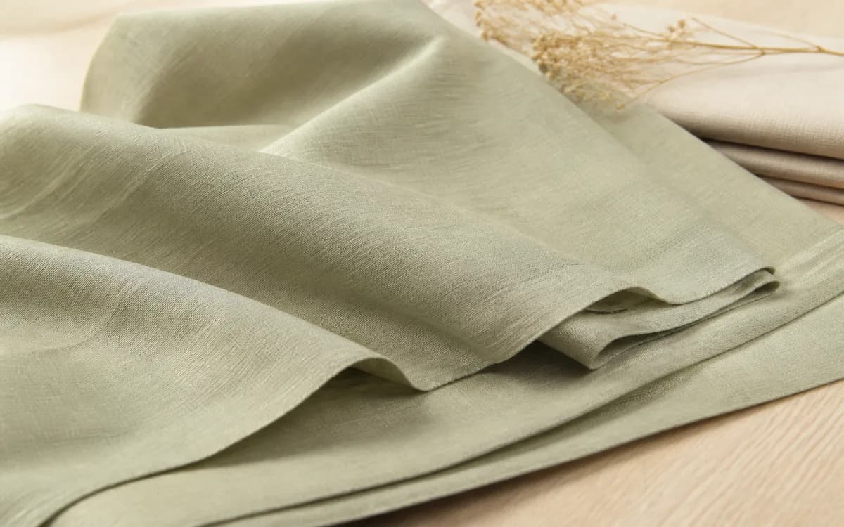 Editorial still life of cotton bed linen, representing home textiles sourcing in Ahmedabad, Gujarat