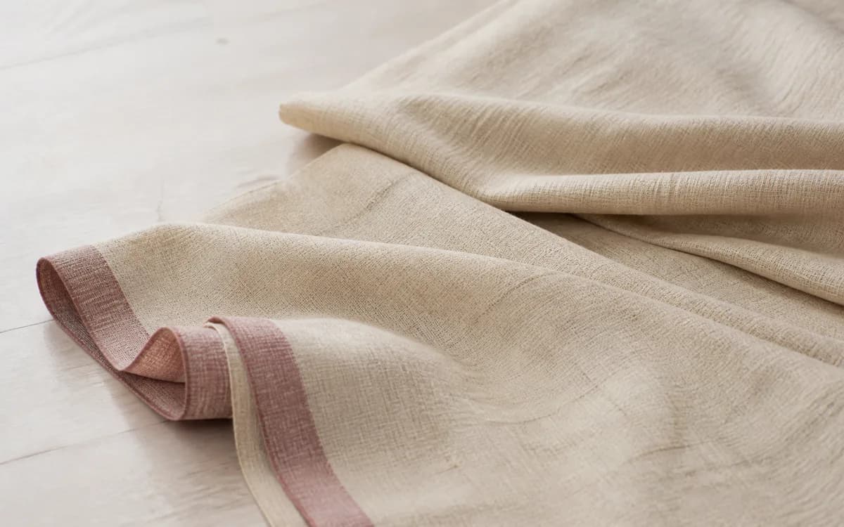 Editorial still life of block-print table linen, representing home textiles sourcing in Jaipur, Rajasthan