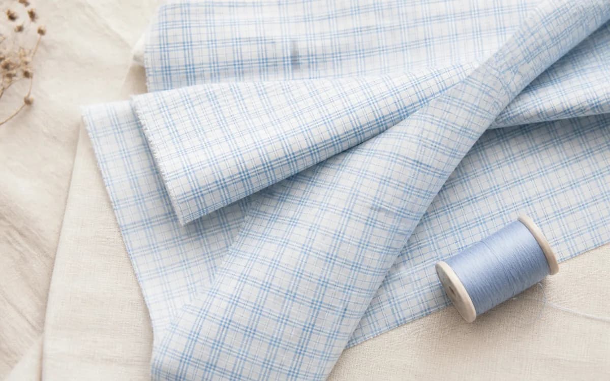 Editorial still life of printed garments, representing readymade garments sourcing in Guntur, Andhra Pradesh